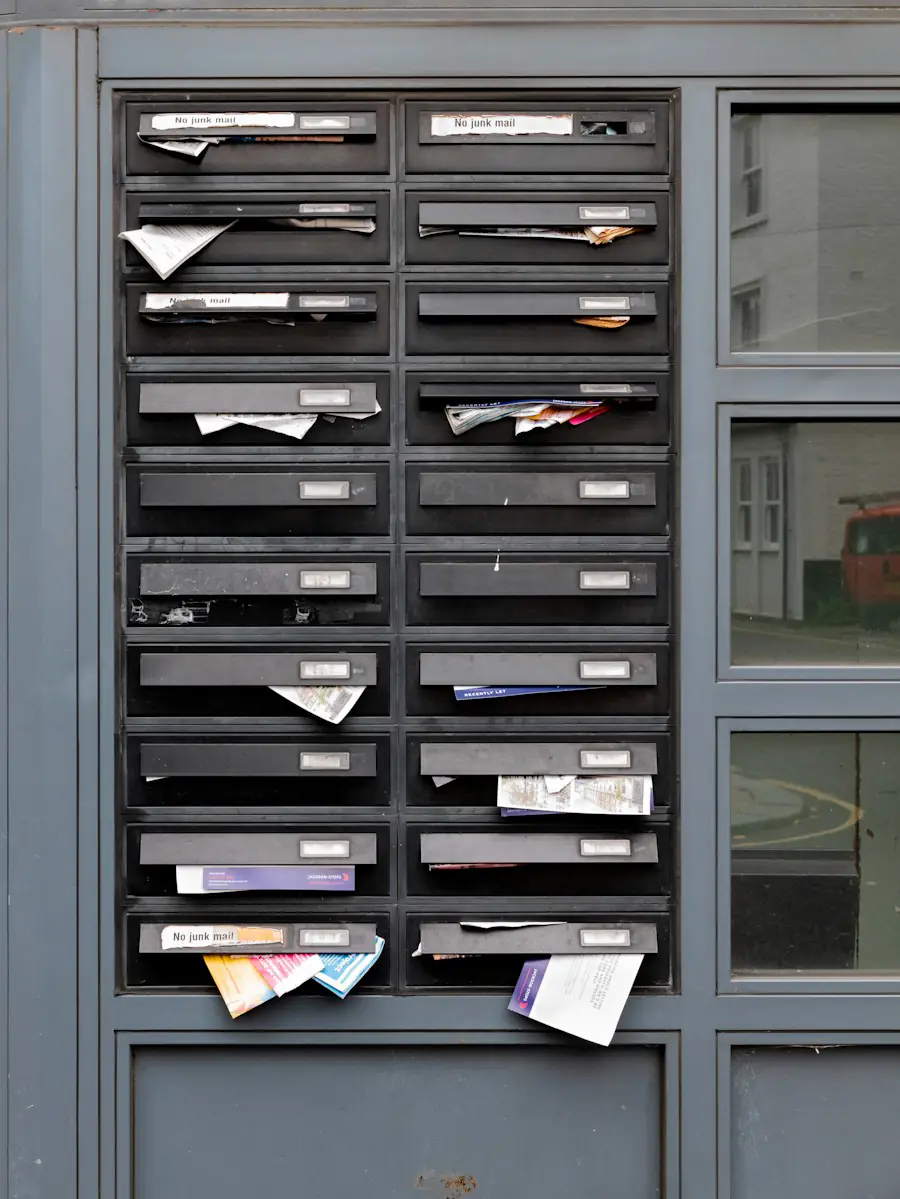 A wall of letterboxes by a building entrance, post and leaflets sticking out of the slots.